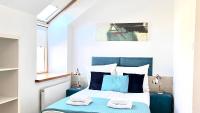 Łóżko lub łóżka w pokoju w obiekcie Hotel77