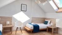 Łóżko lub łóżka w pokoju w obiekcie Hotel77