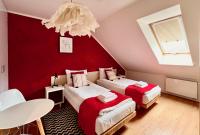 Łóżko lub łóżka w pokoju w obiekcie Hotel77