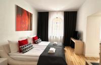 Łóżko lub łóżka w pokoju w obiekcie Hotel77
