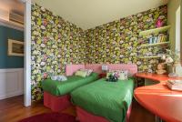 A bed or beds in a room at Villa Isidoro ampio parco ,piscina privata, arte e giochi , fitness