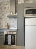 Kuchyň nebo kuchyňský kout v ubytování Apartamentos Puerto Sherry