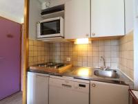 a kitchen with a sink and a microwave at Appartement Termignon, 3 pièces, 8 personnes - FR-1-508-79 in Termignon