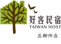 a logo for a hawaiian hospital with a tree and two birds at Country Grange B&amp;B in Yuanshan