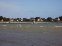 a person windsurfing on a body of water at Hotel au Moyne De Saire in Réville