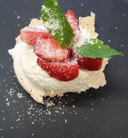 a dessert with strawberries and powdered sugar on it at Bourne Hall Country Hotel in Shanklin