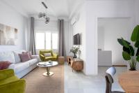 Televízia a/alebo spoločenská miestnosť v ubytovaní Suites Maestranza - Puerta del Arenal by Magno Apartments