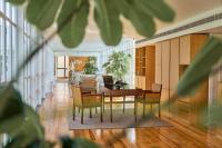 a living room with a table and chairs at PortoBay Serra Golf in Santo António da Serra
