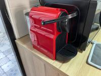 a red appliance sitting on top of a shelf at Le Briais in Melun