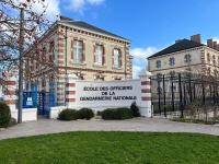 a building with a sign that reads people ties officers della gendarmerie at Le Briais in Melun
