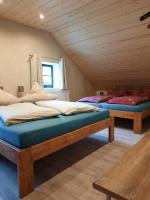 Postel nebo postele na pokoji v ubytování Steinhaus / Kamenny Dum