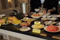 a buffet with different types of food on a table at Confetti Garden Hotel in Vang Vieng