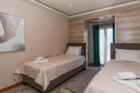 A bed or beds in a room at Star Jasmine House Acharavi