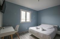 Łóżko lub łóżka w pokoju w obiekcie Kokana modern holiday home