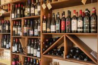 a room filled with lots of bottles of wine at Le Servite Apartments in Arco