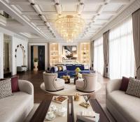 a living room with couches and a chandelier at Jumeirah Mina Al Salam Dubai in Dubai