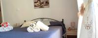 Posteľ alebo postele v izbe v ubytovaní Casa Vacanze dalla Nonnina