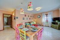 A television and/or entertainment centre at Casa Angiolina Lake And Mountain View - Happy Rentals