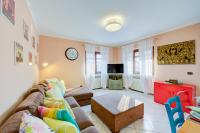 A television and/or entertainment centre at Casa Angiolina Lake And Mountain View - Happy Rentals