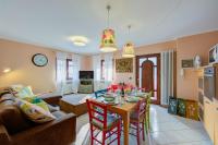 A television and/or entertainment centre at Casa Angiolina Lake And Mountain View - Happy Rentals