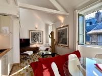 Televízia a/alebo spoločenská miestnosť v ubytovaní La Petite Adresse du 10Honfleur
