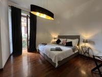A bed or beds in a room at EMI's Guest House