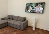 A television and/or entertainment centre at StarHome San Paolo