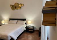 A bed or beds in a room at StarHome San Paolo