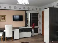 Televízia a/alebo spoločenská miestnosť v ubytovaní Guesthouse Villa Plitvička