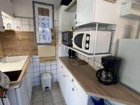 Kuchnia lub aneks kuchenny w obiekcie Pavillon 3 Pièces avec Jardinet, Terrasse, et Piscine - 4 Personnes, Vendres - FR-1-701-26