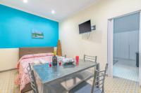 A television and/or entertainment centre at Eracles House near Ortigia Island