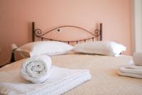 Posteľ alebo postele v izbe v ubytovaní Kyriakos Apartment