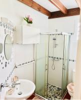 a bathroom with a shower and a sink at Villa Paradis in Le François