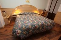 Posteľ alebo postele v izbe v ubytovaní GH Hotel Fratazza
