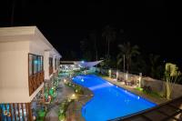 a swimming pool at night in a resort at Bakawan Hideaway Resort and Restaurant in Tomas Oppus