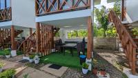 a patio with a table and some plants at Bakawan Hideaway Resort and Restaurant in Tomas Oppus