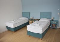 A bed or beds in a room at Alte Post Greifenstein