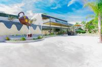 a resort building with a pool in front of it at Hotel Casa Lili in Jávea