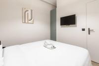 Posteľ alebo postele v izbe v ubytovaní HSH Saint Lazare-Opéra Calm & Cosy Apartment