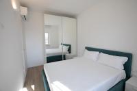 A bed or beds in a room at D Suite Fronte Mare