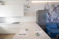 A kitchen or kitchenette at D Suite Fronte Mare