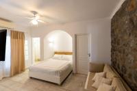 Postel nebo postele na pokoji v ubytování Mykonos Psarou Place