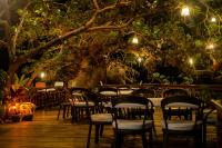 Un jardín fuera de Kudugman Beach Cottages - El Nido