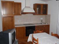 Kuchyň nebo kuchyňský kout v ubytování Apartments Ariana
