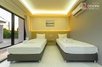 Postel nebo postele na pokoji v ubytování Modern Resort
