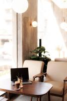 a laptop on a wooden table in a room at TTR Central Apart Hotel in Da Lat