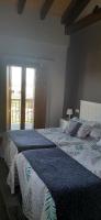Postel nebo postele na pokoji v ubytování El Rato Apartamentos Rurales