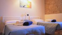 A bed or beds in a room at B&B QUINTARELLI