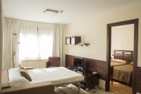 A bed or beds in a room at Apartamentos Costa Esmeralda