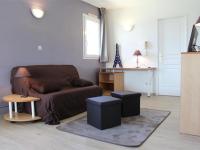 a living room with a couch and a table at Appartement La Rochelle, 2 pièces, 4 personnes - FR-1-246-648 in La Rochelle